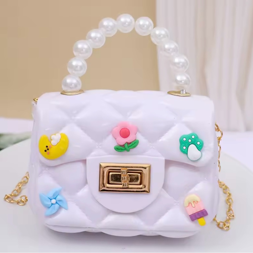 Chic White Quilted Handbag with Pearl Handle and a Gold Plated Shoulder Strap.